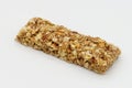 Cereal bar with apricot, apple and dried fruit on white background Royalty Free Stock Photo