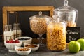 Cereal bar or buffet wih cornflakes, fruit and nuts Royalty Free Stock Photo