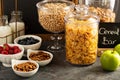 Cereal bar or buffet wih cornflakes, fruit and nuts Royalty Free Stock Photo