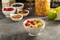 Cereal bar or buffet wih cornflakes, fruit and nuts Royalty Free Stock Photo