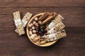 Cereal bars with nuts, berries and cinnamon on a wooden background. Top view. Food background Royalty Free Stock Photo