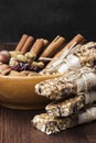 Cereal bars with nuts, berries and cinnamon on a wooden background Royalty Free Stock Photo