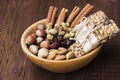 Cereal bars with nuts, berries and cinnamon on a wooden background Royalty Free Stock Photo