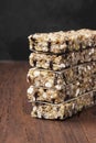 Cereal bars with nuts, berries and cinnamon on a wooden background Royalty Free Stock Photo