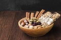 Cereal bars with nuts, berries and cinnamon on a wooden background. Copy space. Food background Royalty Free Stock Photo