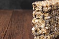 Cereal bars with nuts, berries and cinnamon on a wooden background. Copy space. Food background Royalty Free Stock Photo