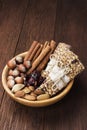 Cereal bars with nuts, berries and cinnamon on a wooden background Royalty Free Stock Photo