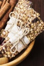 Cereal bars with nuts, berries and cinnamon on a wooden background Royalty Free Stock Photo