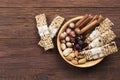 Cereal bars with nuts, berries and cinnamon on a wooden background. Top view, copy space. Food background Royalty Free Stock Photo