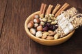 Cereal bars with nuts, berries and cinnamon on a wooden background. Copy space. Food background Royalty Free Stock Photo