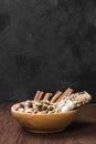 Cereal bars with nuts, berries and cinnamon on a wooden background Royalty Free Stock Photo