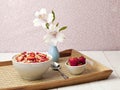 Cereal bowl with strawberres in a tray Royalty Free Stock Photo