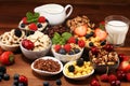 Cereal. Bowls of various cereals, berries and milk for breakfast. Muesli with kids cereals Royalty Free Stock Photo