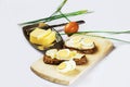 Cereal bread,boiled egg, butter,chive, wooden board. Royalty Free Stock Photo