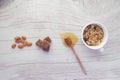 cereal breakfast in bowl , almond nut. chocolate and honey on table