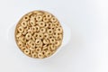 Cereal cheerios in bowl on white background Royalty Free Stock Photo