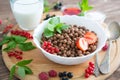 Cereal chocolate balls in bowl with milk on rustic wooden table Healthy tasty breakfast chocolate balls with Royalty Free Stock Photo