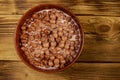 Cereal chocolate balls with milk in a bowl on wooden table. Top view Royalty Free Stock Photo