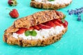 Cereal croissants with cream cheese and fresh strawberries. Royalty Free Stock Photo