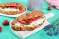 Cereal croissants with cream cheese and fresh strawberries. Useful breakfast. Royalty Free Stock Photo