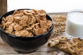 A healthy breakfast. Cereals are at the black plate on the wood background Royalty Free Stock Photo