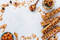 Cereal granola bar with nuts, fruits and berries on a whhite stone table. Granola bar. Healthy snack. Royalty Free Stock Photo