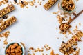 Cereal granola bar with nuts, fruits and berries on a whhite stone table. Granola bar. Healthy snack. Royalty Free Stock Photo