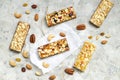 Cereal granola bars with nuts and dry berries on a white background. Top view healthy snack. Royalty Free Stock Photo