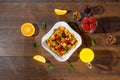 Cereal, morning breakfast, corn flakes, raisins, almonds, mint leaves, orange juice, strawberry, top view, on a dark wooden Royalty Free Stock Photo