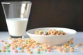 cereal rings floating in a bowl of milk