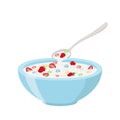 Cereal rings, strawberry, spoon and bowl. Oatmeal breakfast with milk Royalty Free Stock Photo