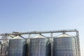 Cereal silos under the blue sky. Industrial storage