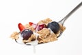 Cereals bowl with red fruits isolated on white