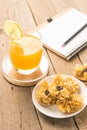 Cereals cracker snack and orange juice healthy on table wood ba Royalty Free Stock Photo