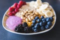 Cereals and fruits superbowl, healthy bowl breakfast with flakes, oat and fruits: raspberries, blueberries, banana, blackberries Royalty Free Stock Photo