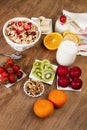 Cereals, fruits and yogurt on a wooden table for breakfast Royalty Free Stock Photo