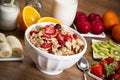 Cereals, fruits and yogurt on a wooden table for breakfast Royalty Free Stock Photo