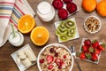 Cereals, fruits and yogurt on a wooden table for breakfast Royalty Free Stock Photo