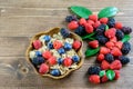 Cereals integral with seasonal forest berries in the wooden bowl and on the wood background. Proper nutrition, balanced diet Royalty Free Stock Photo