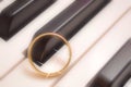 Wedding ring on piano keys instrumental music