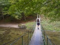 Small metallic pedestrian bridge over Cerna river, Romania, Europe Royalty Free Stock Photo