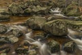 Cerny creek in Jizerske mountains in dark day Royalty Free Stock Photo