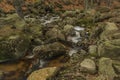 Cerny creek in Jizerske mountains in dark day Royalty Free Stock Photo