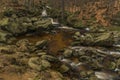 Cerny creek in Jizerske mountains in dark day Royalty Free Stock Photo