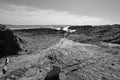 Cerritos Beach rocky granite surf spot in Baja California in Mexico - black and white Royalty Free Stock Photo