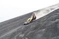 CERRO NEGRO, NICARAGUA - APRIL 26, 2016: Tourist is volcano boarding from Cerro Negro volcano, Nicarag