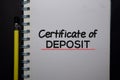 Certificate of Deposit write on a book isolated on black table Royalty Free Stock Photo