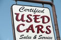 certified used cars writing caption text sign hanging from metal post. p