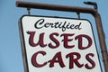 certified used cars writing caption text sign hanging from metal post. ph