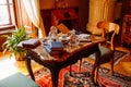 Cervena Lhota, South Bohemia, Czech Republic, 9 October 2021: Castle interior with baroque wooden carved furniture, bedroom, table